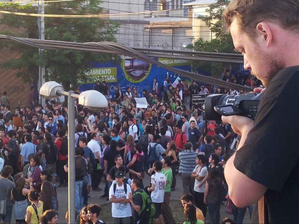 Nick Films a crowd in Santiago