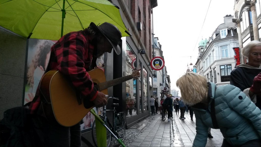 Guitarist under umbrella